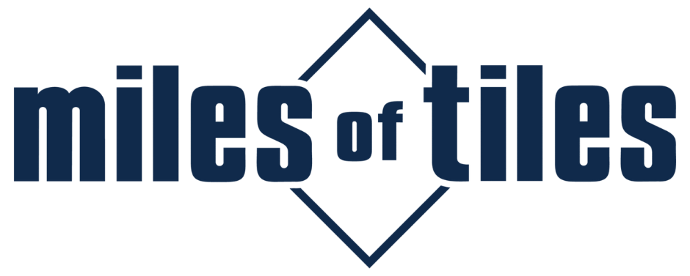 Miles of Tiles logo in dark blue with a geometric diamond symbol