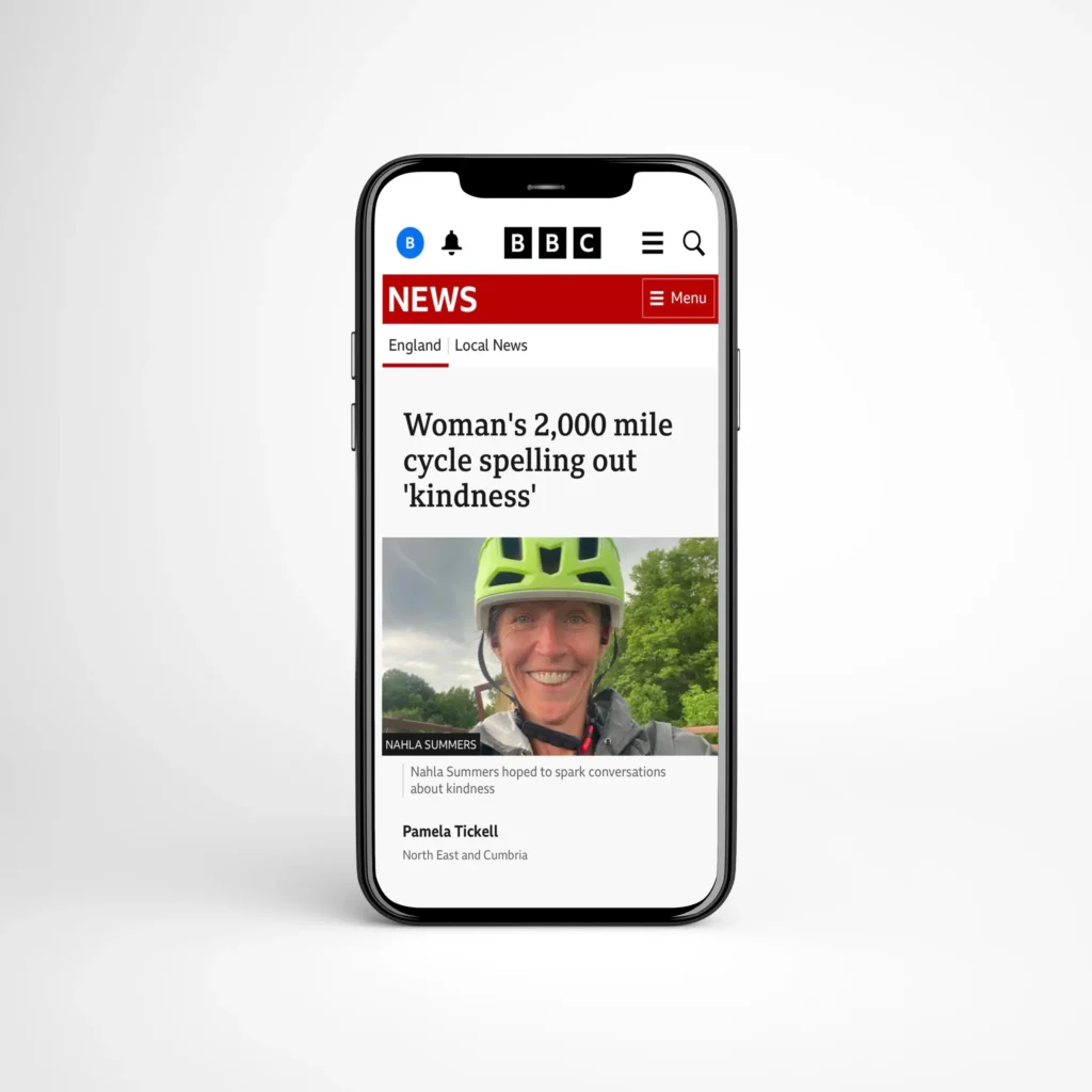 Smartphone mockup showing a BBC News article about a woman's 2,000-mile cycle, with a portrait of the cyclist.